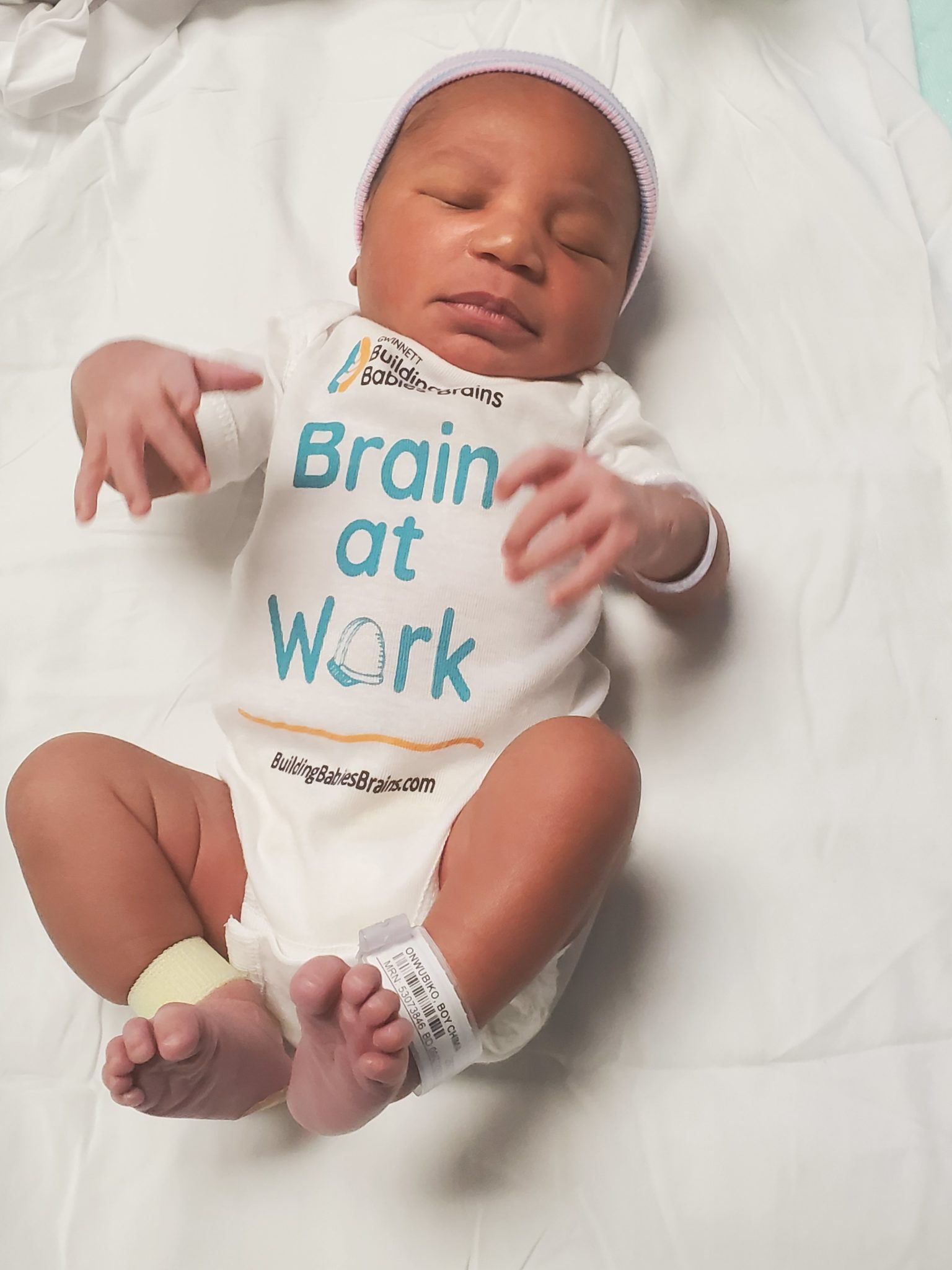 Baby Onwubiko In a Brain at Work Onesie