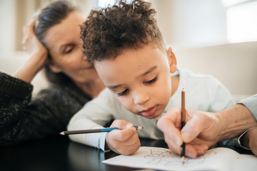 Child holding pencil with tripod grasp